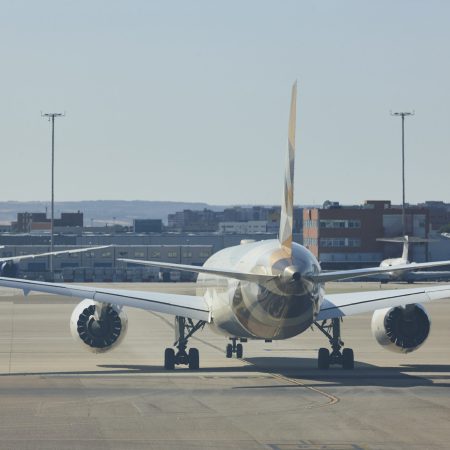 Comercial airplane in the runway. Transportation and tourism industry. Journey